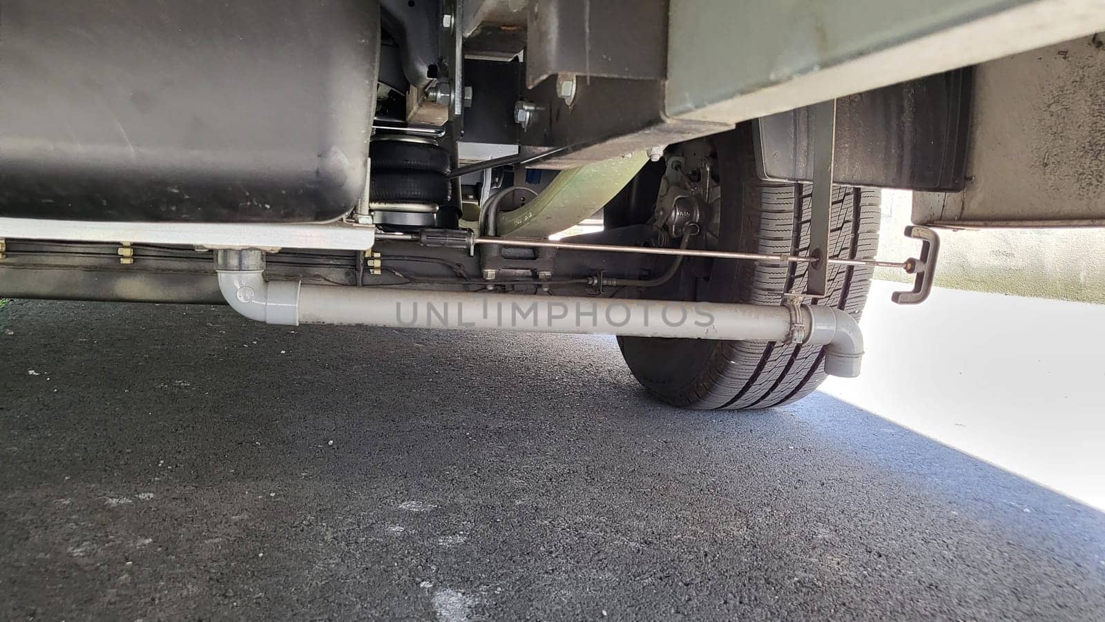 VELBERT, NRW, GERMANY - June 16, 2022:..Installation of an additional air suspension in a mobile home to increase the load capacity