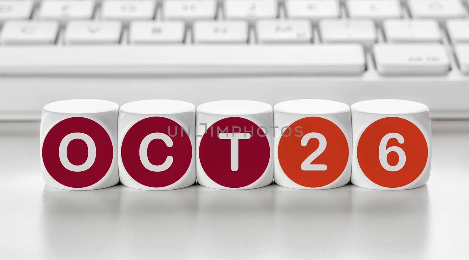 Letter dice in front of a keyboard - October 26