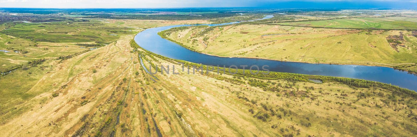 Rechytsa, Gomel Region, Belarus. Aerial View Of Dnieper River. Sky Above Green Meadow And River Landscape. Top View Of European Nature From High Attitude In Summer. Bird's Eye View. Panorama.