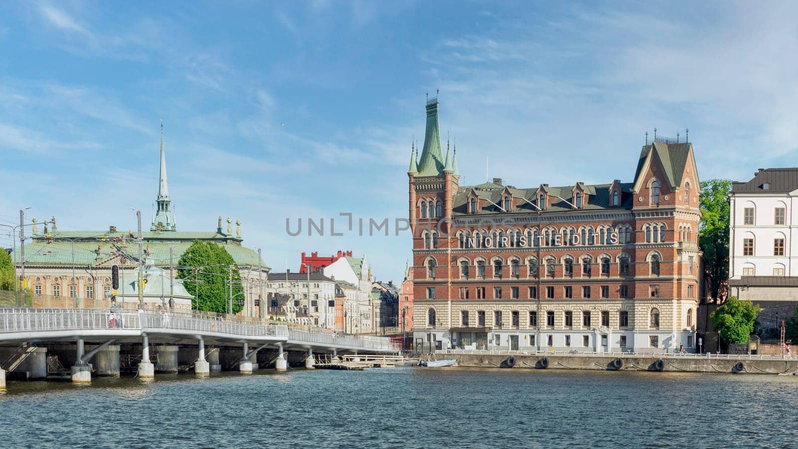 View from City Hall overlooking Riddarholmshamnen Island, with Centralbron bridge, mediating Norstedt Building, or Norstedtshuset, and House of Nobility, or Riddarhuset, Stockholm, Sweden