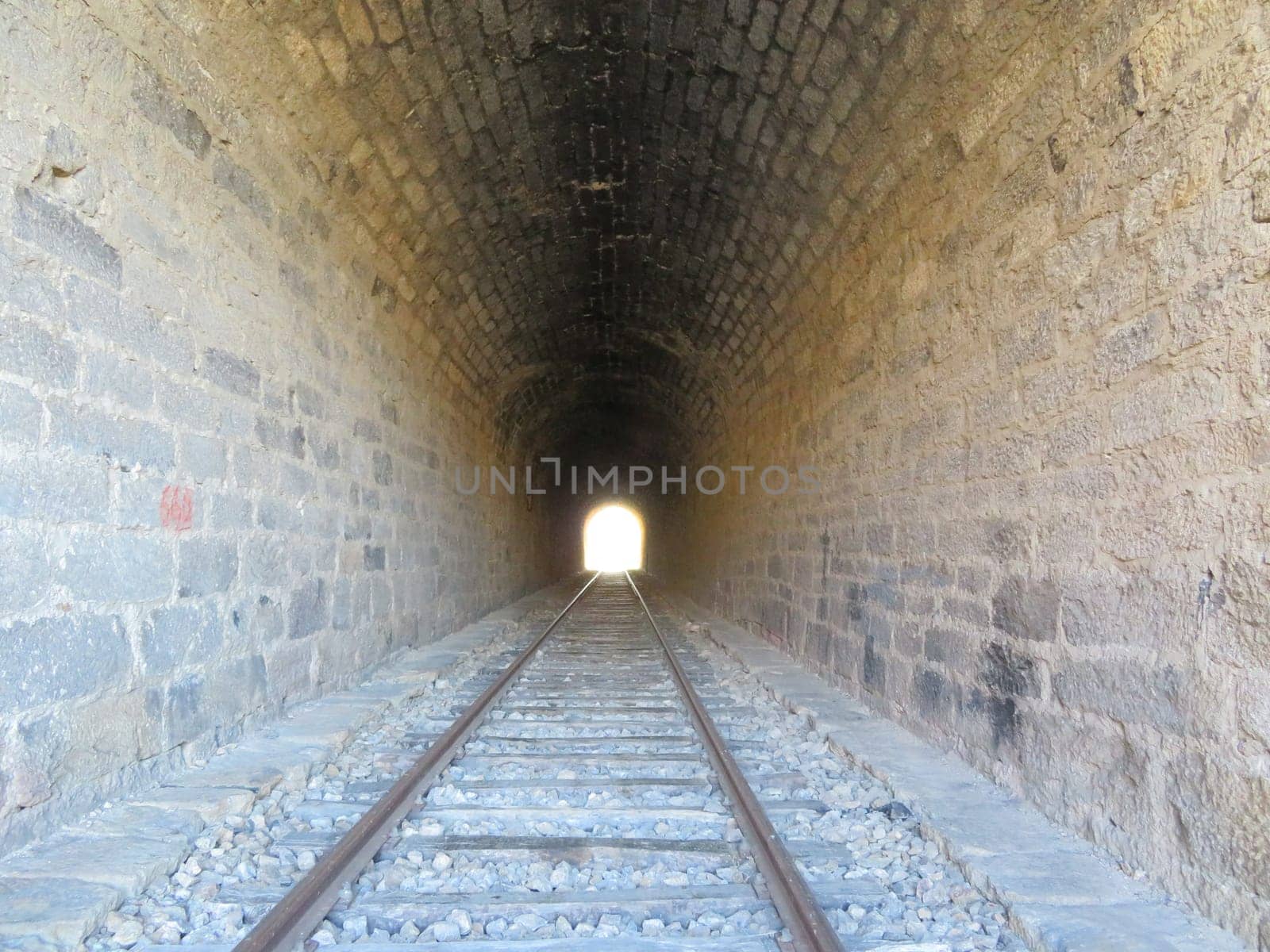 iron road bridges metal rail light at the end of the tunnel train transport