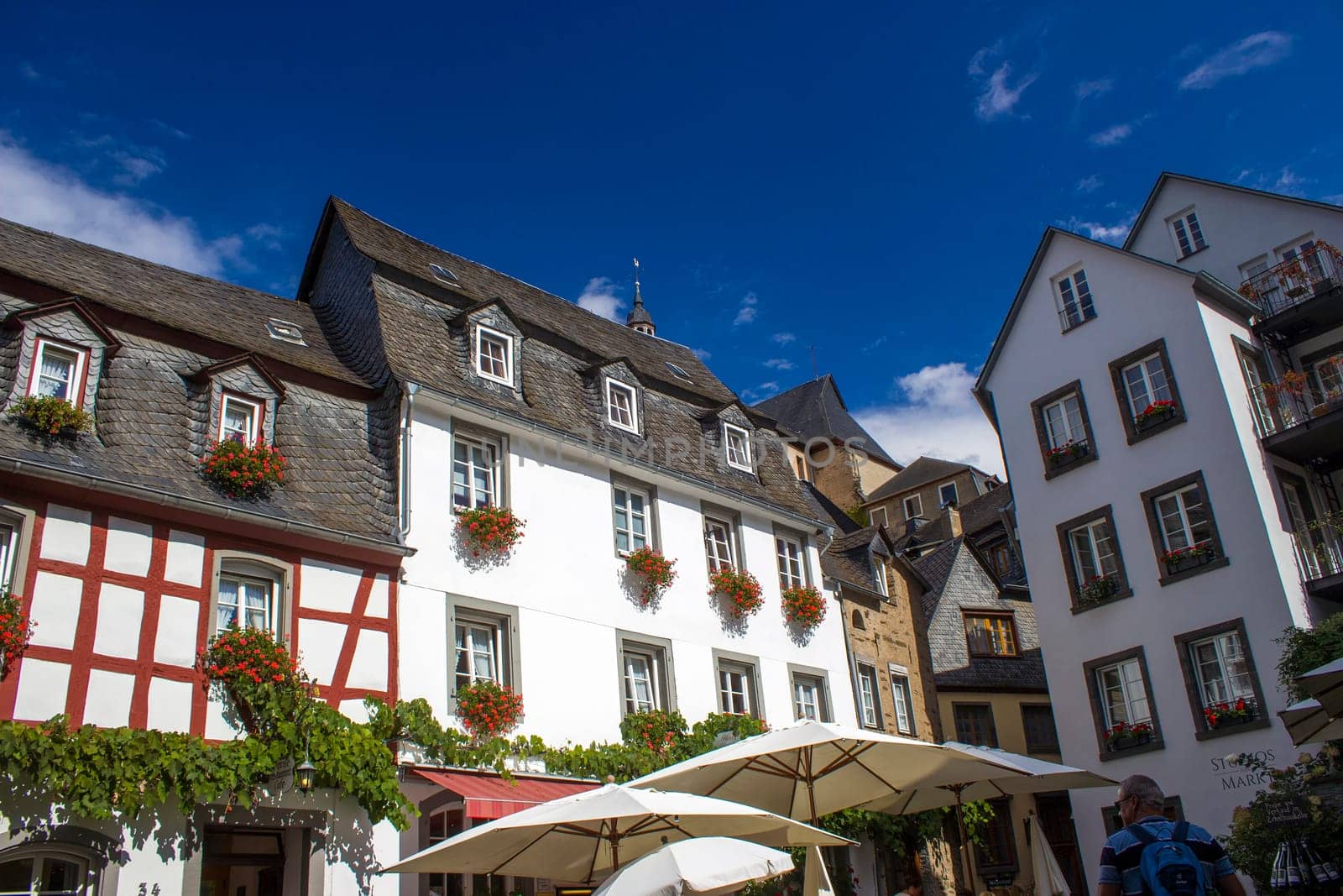 Beilstein - historic village along the river Moselle with old half-timbered houses and the ruins of castle Metternich on top of the hills, Germany