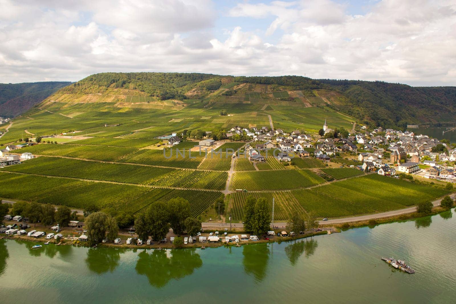 Aerial view of the Moselle valley with vineyards, the river Moselle and the villages Ellenz-Poltersdorf and Poltersdorf seen from castle Metternich in Beilstein, Rhineland-Palatinate, Germany.