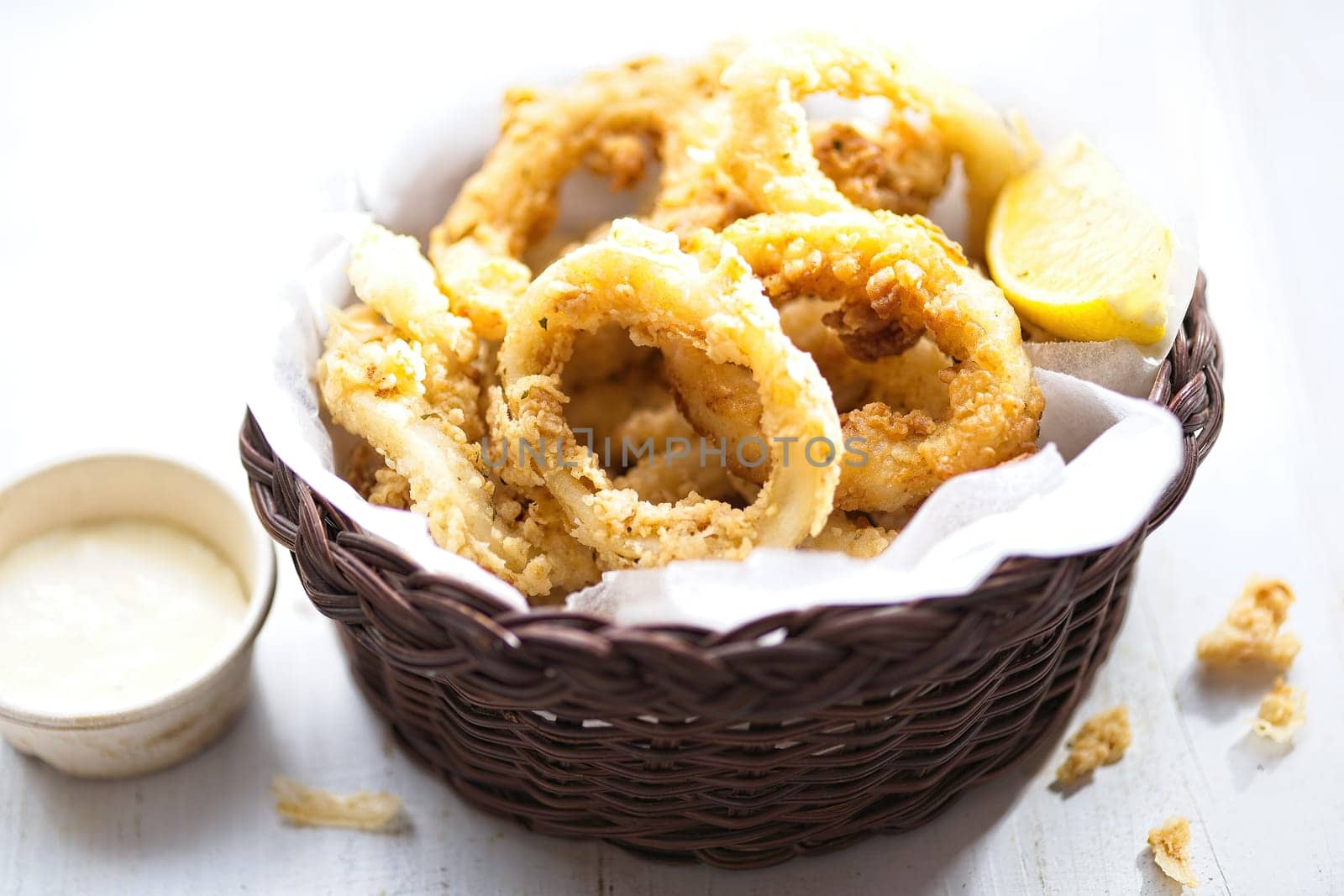 close up of basket of golden italian fried calamari