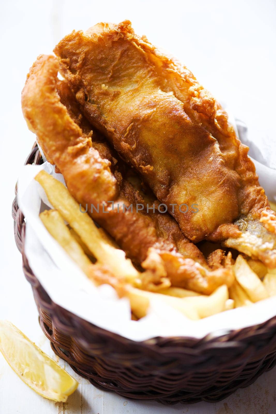 close up of traditional golden english fish and chips