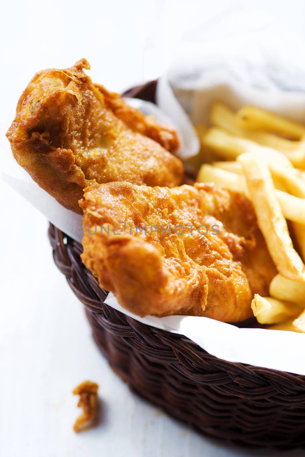 close up of traditional golden english fish and chips
