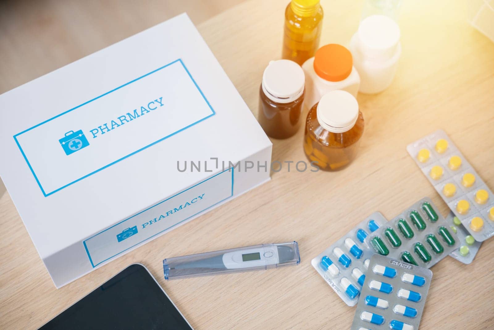 Online purchase delivery of medicines to your home from drugstore, Home medicine with medicine package box free first aid kit with pills from pharmacy hospital delivery service on table in living room
