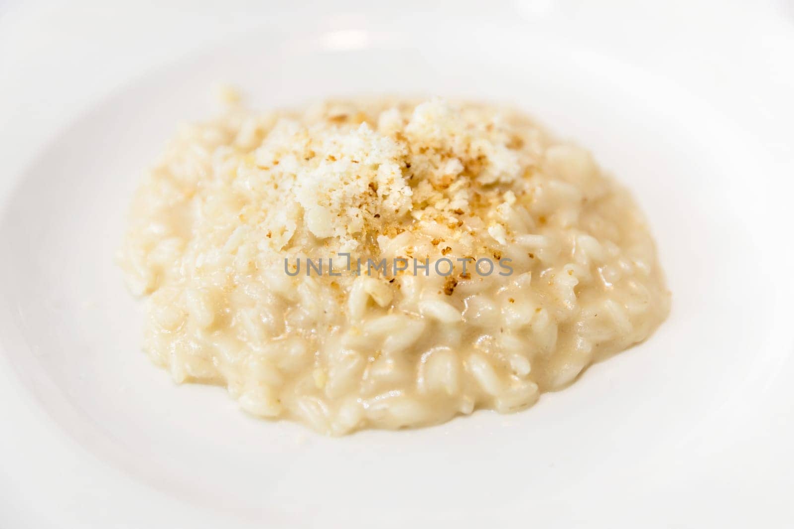 Carnaroli rice parmigiana with Castelmagno and bread crispy.