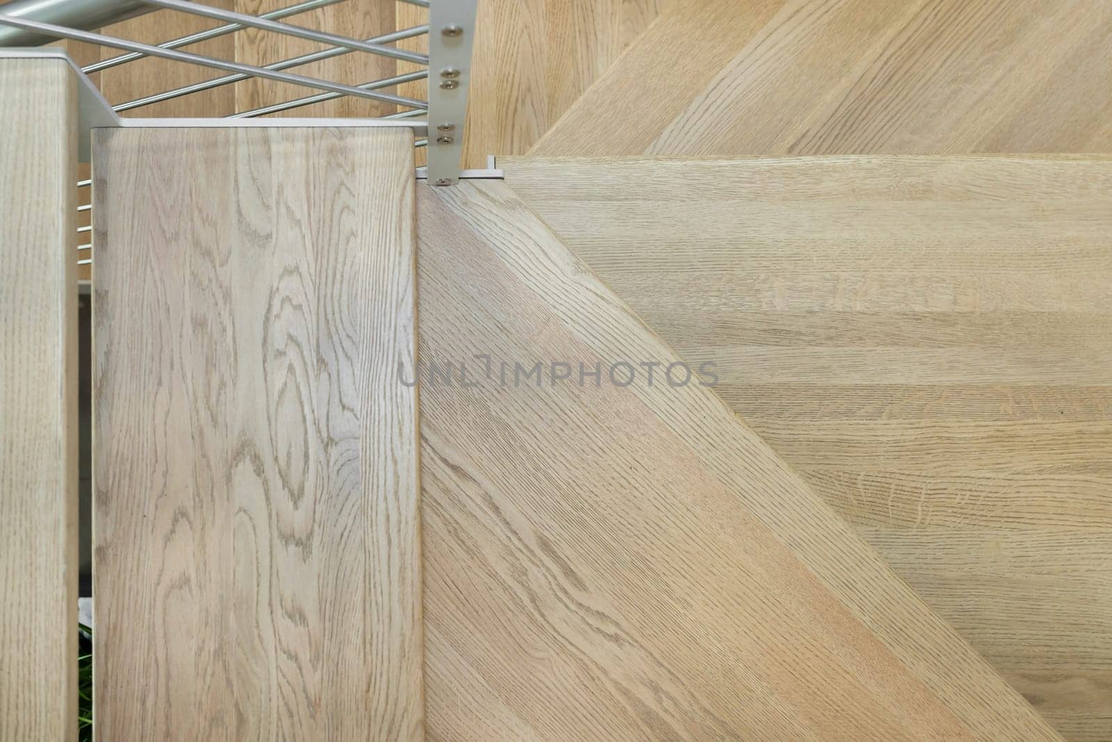 Modern residential wooden stairs. Wood staircase inside contemporary white modern house.