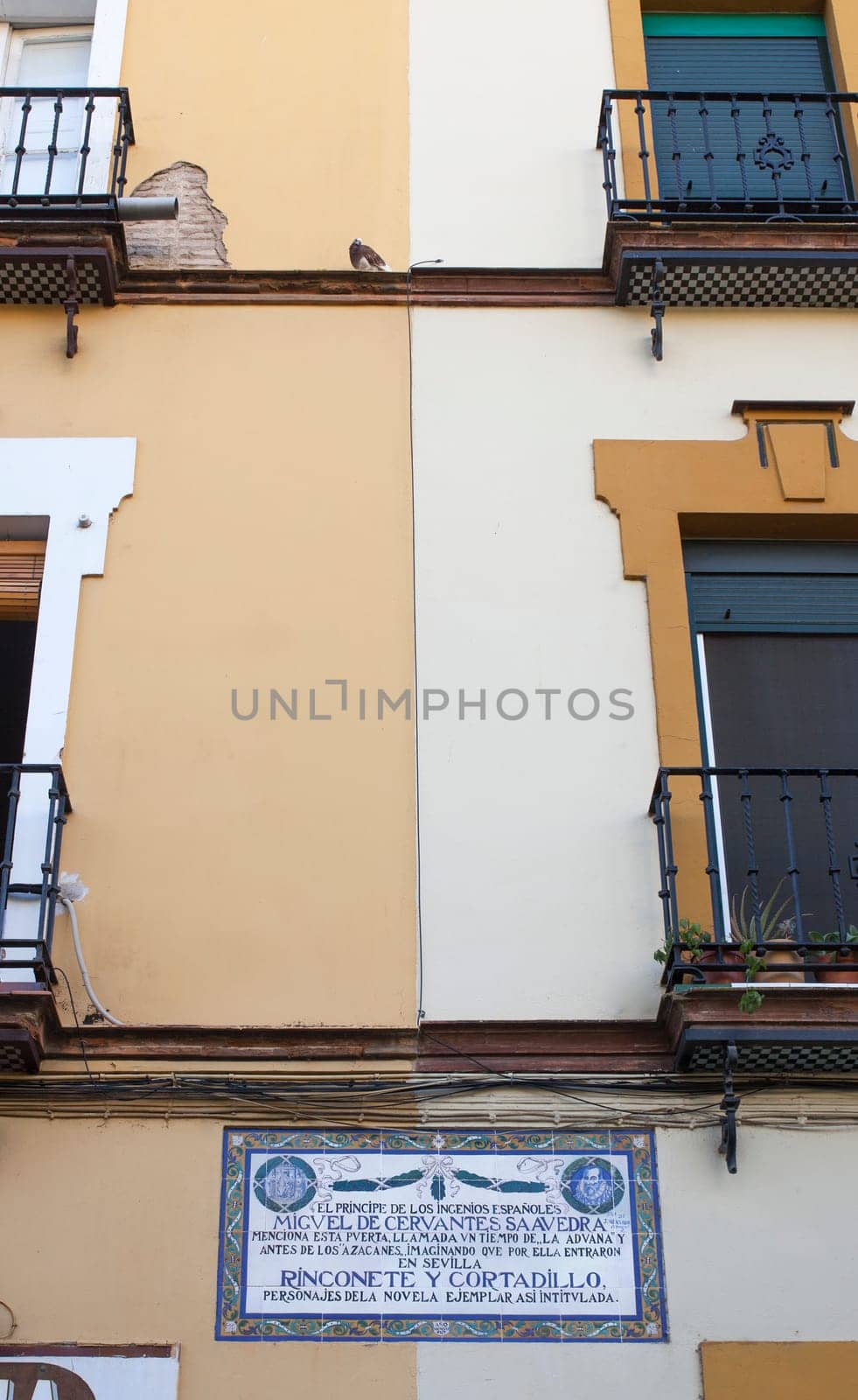 Seville, Spain - Sept 27th, 2020: Miguel de Cervantes Saavedra memorial plaque, about Rinconete y Cortadillo novel, Seville, Spain