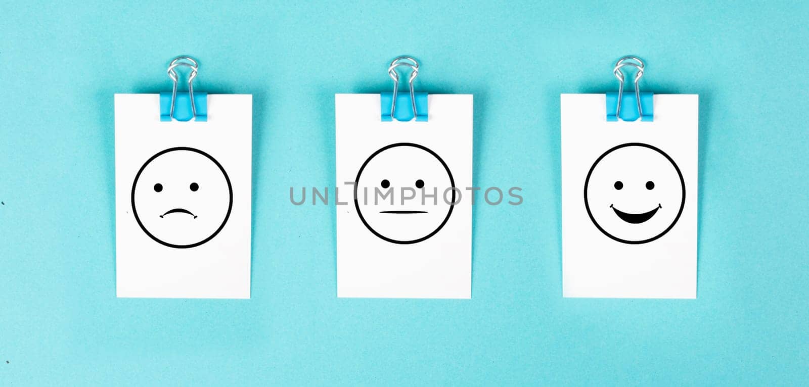 Head with a sad and a happy face, mental health concept, positive and negative mindset, depression, support and evaluation symbol, emotion