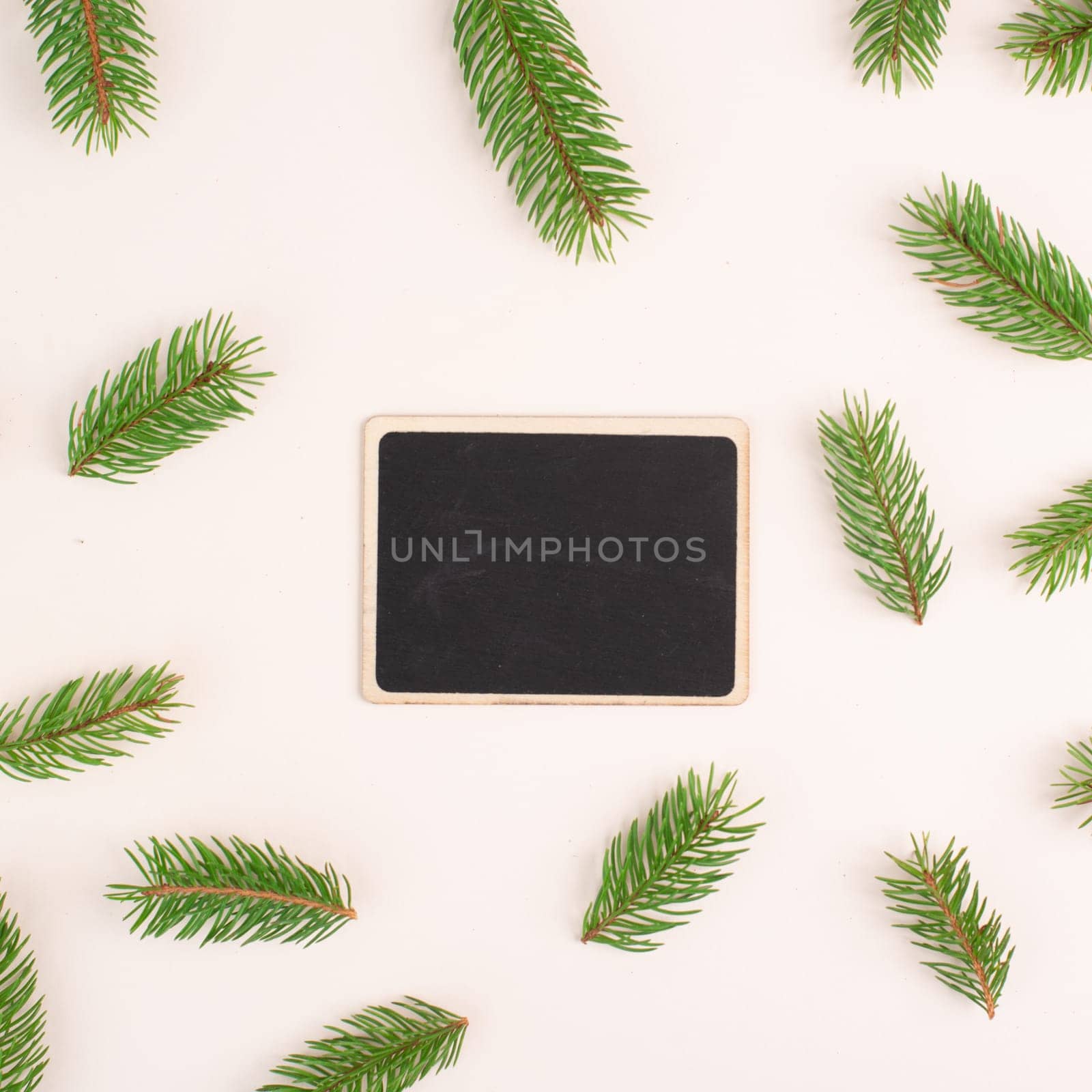 Christmas holiday background, chalkboard with fir branches, winter season greeting card with copy space