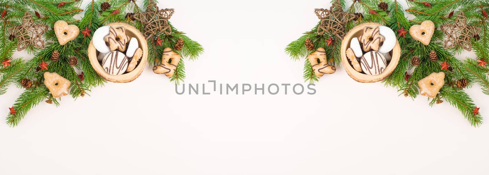 Christmas tree made from fir branches, red stars and a cinnamon stick as the trunk, greeting card with copy space