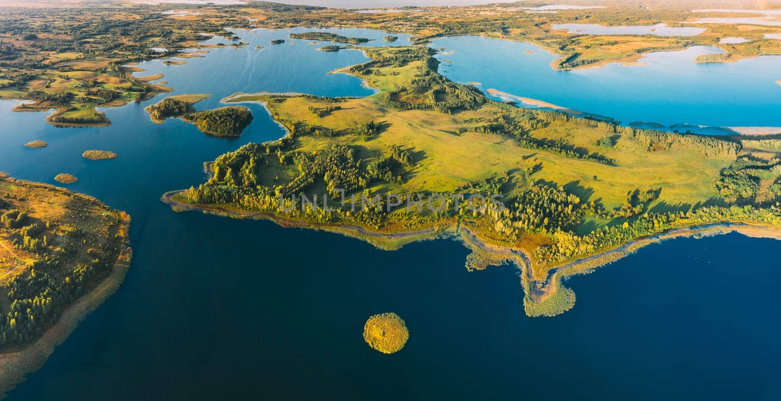 Braslaw Or Braslau, Vitebsk Voblast, Belarus. Aerial View Of Nedrava Lake, Voyso Lake And Green Forest Landscape In Sunny Autumn Morning. Top View Of Beautiful European Nature From High Attitude. Bird's Eye View. Famous Lakes. Natural Landmarks. Small Islands. Panorama