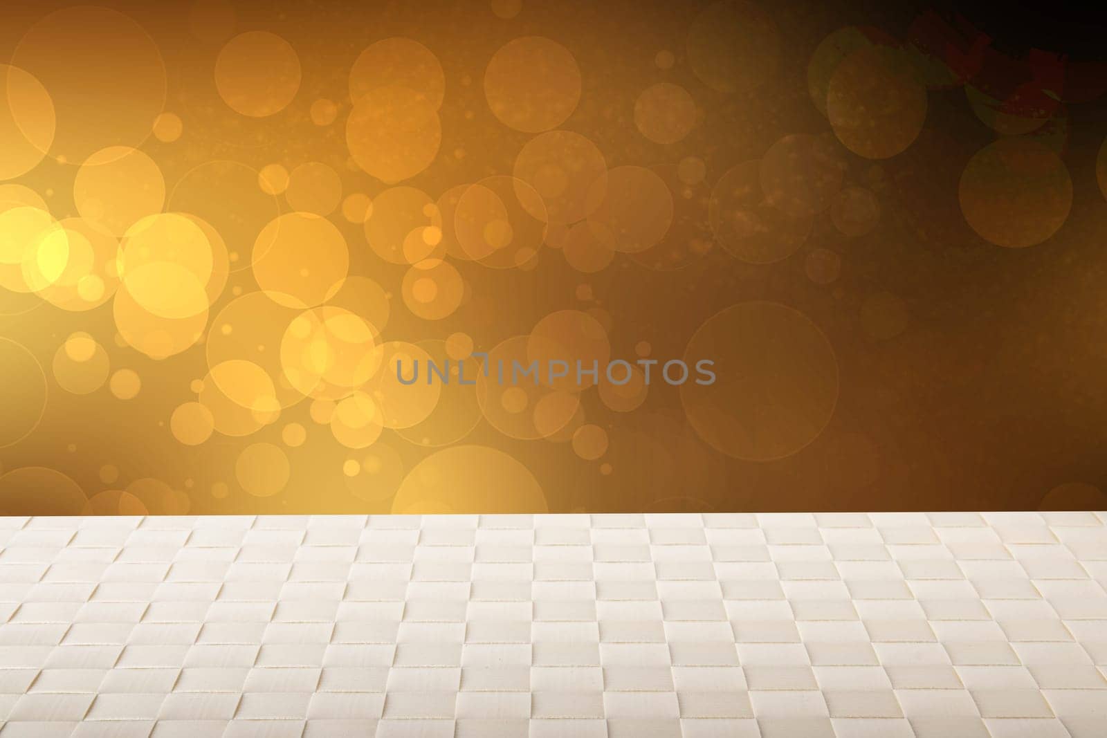 Empty table background. Empty wooden table covered with a bright tablecloth over abstract festive gold yellow background. Space for your food and product display montage.