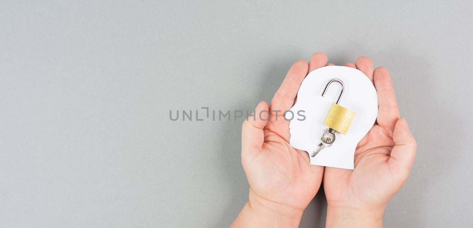 Silhouette of a head with an open lock, free mind, uncontrolled thoughts, freedom of speech concept