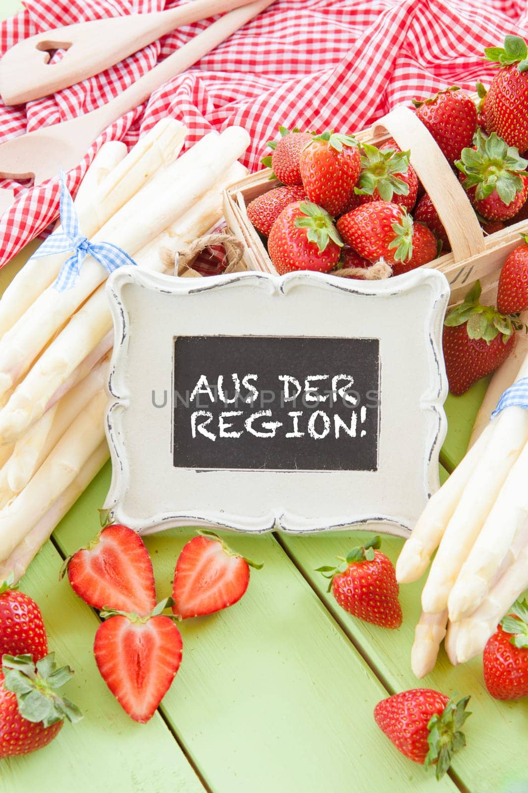 Fresh white asparagus and ripe red strawberries