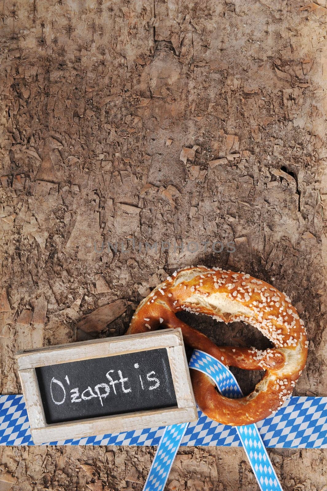 original Bavarian lye pretzels with table on real brown tree bark