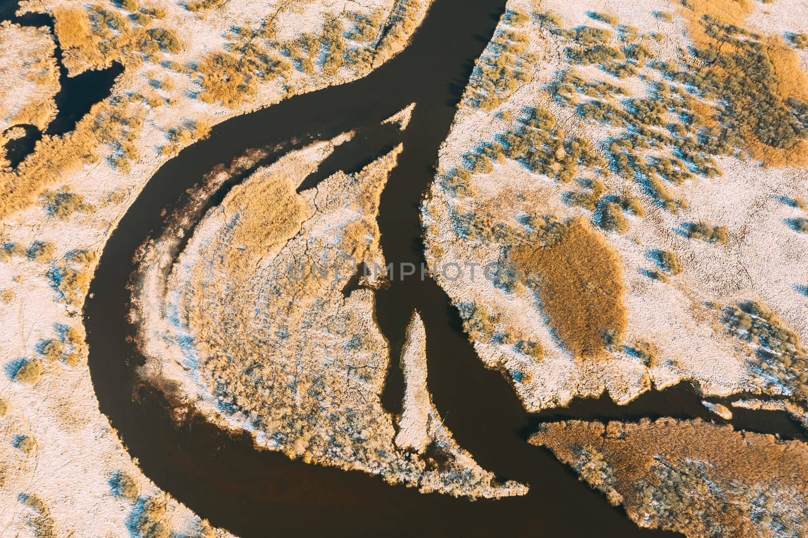 Belarus. Aerial View Of Small Island And Curved River Landscape In Early Spring Day. High Attitude View. Marsh Bog. Drone View. Bird's Eye View.
