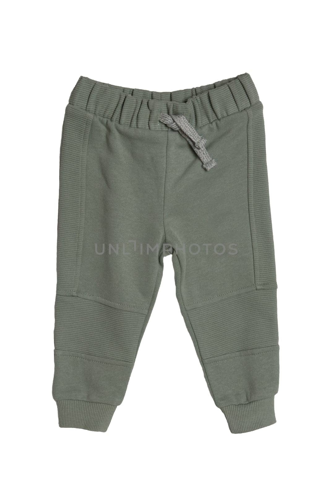 Children's sportswear. Close-up of a green Kids baby sports sweatpants isolated on white background. Spring and autumn fashion pants for childs.