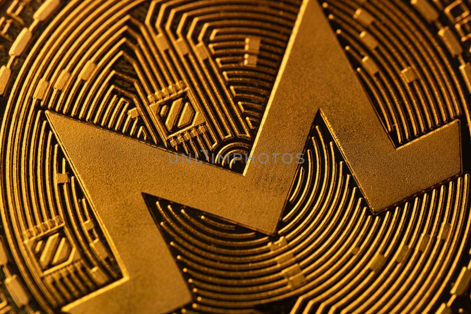 top view extreme macro closeup of crypto Monero golden coin logo symbol