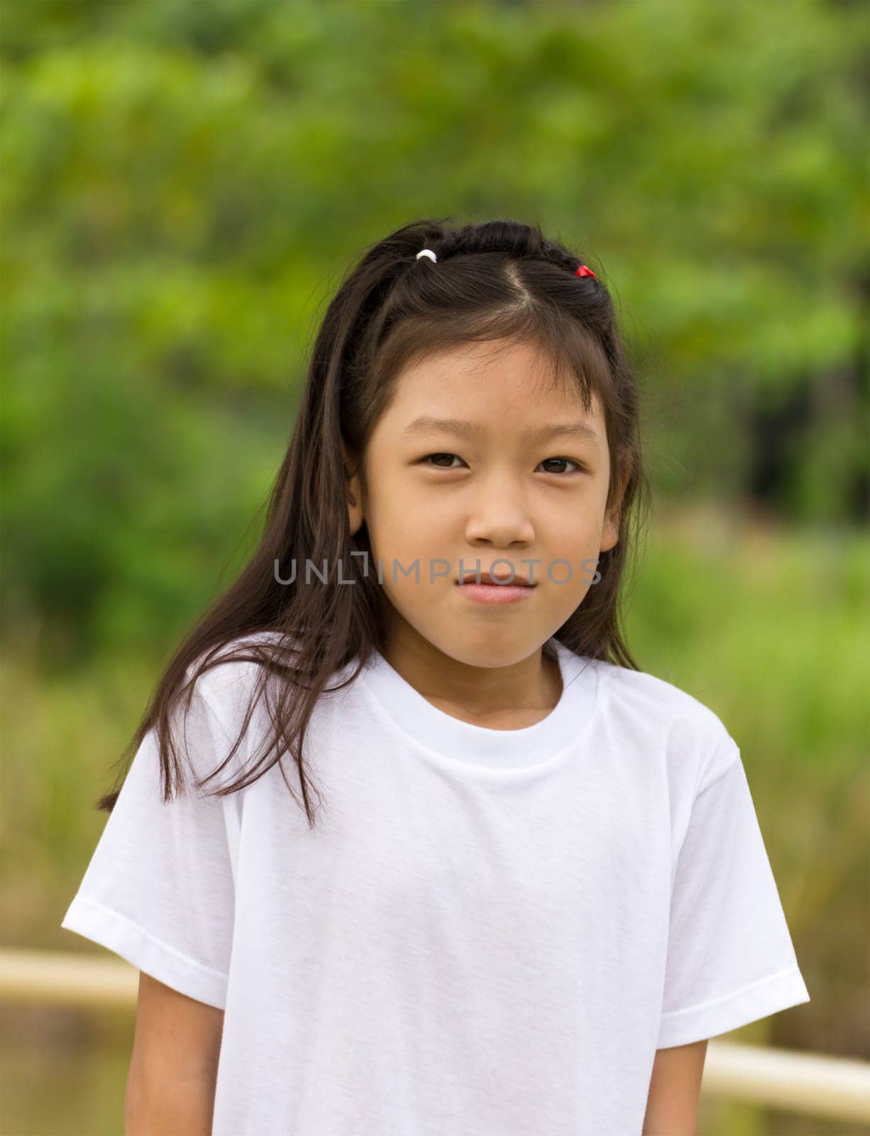 Outdoors portrait of beautiful Asian young girl