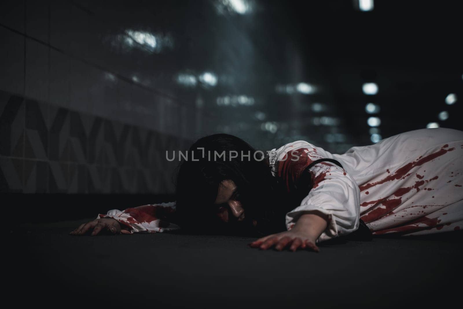 Horror bloodthirsty woman ghost horror she death and scary at dark night in tunnel, The girl was hit by a car and lying died on the road. full of blood left unattended, Happy halloween day festival