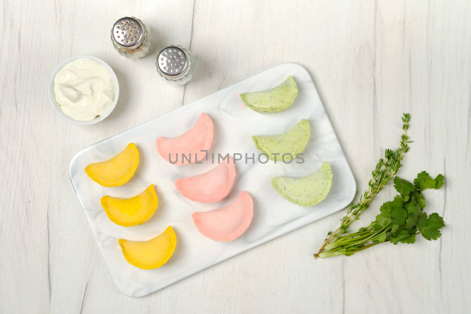 Top view of frozen colorful dumplings with chicken and turkey ground meat