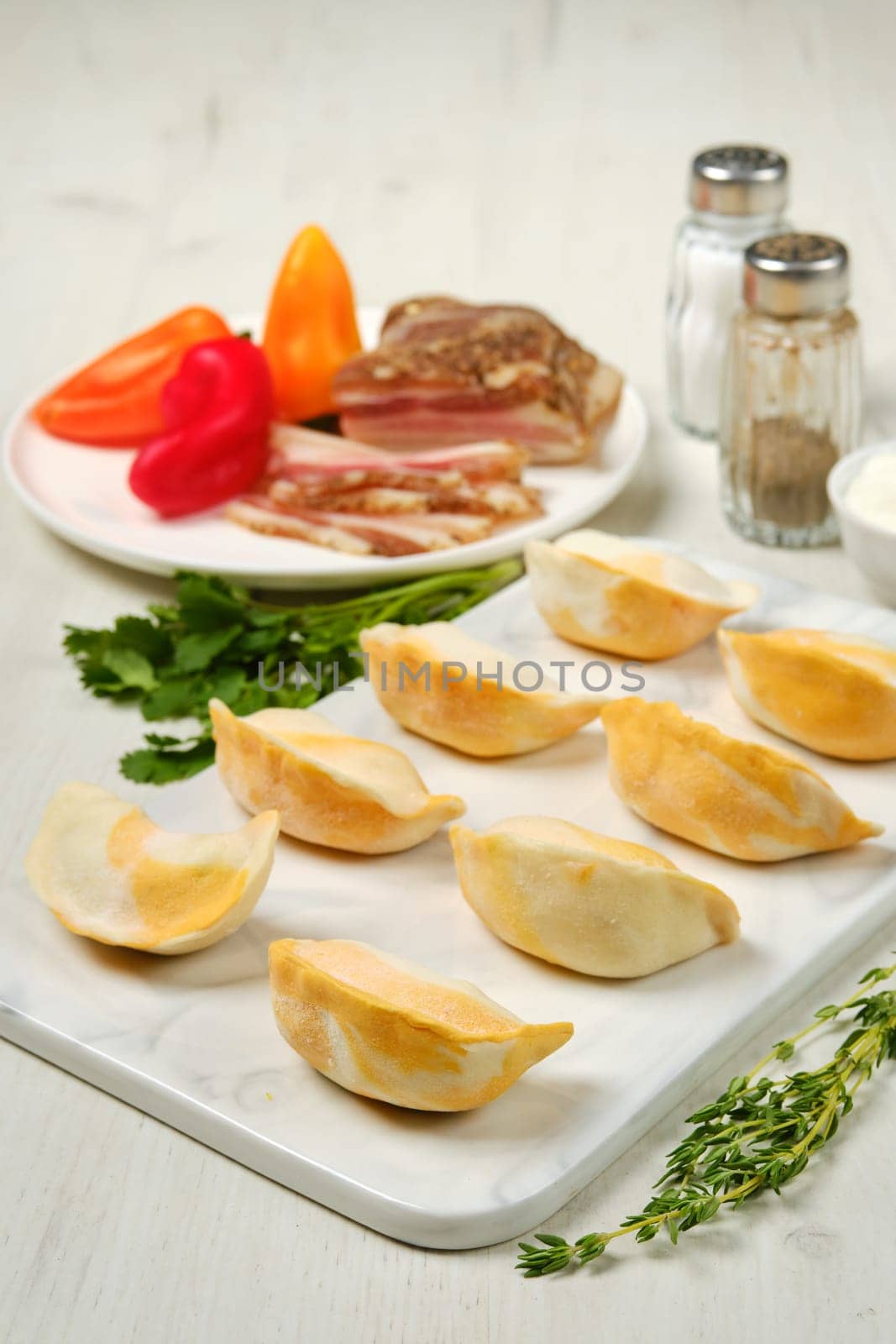 Frozen dumplings with bacon and mashed potato