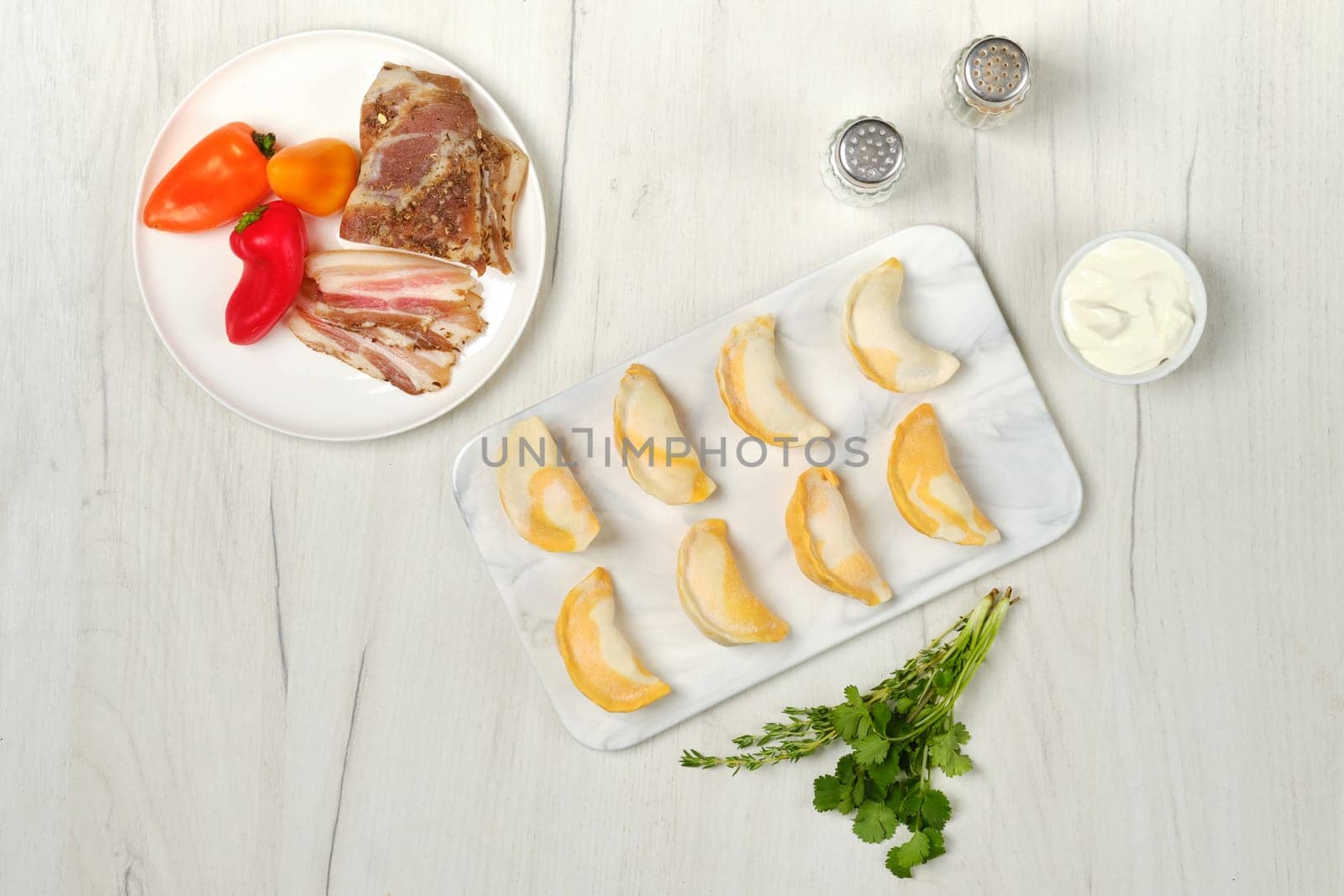 Top view of frozen dumplings with bacon and mashed potato