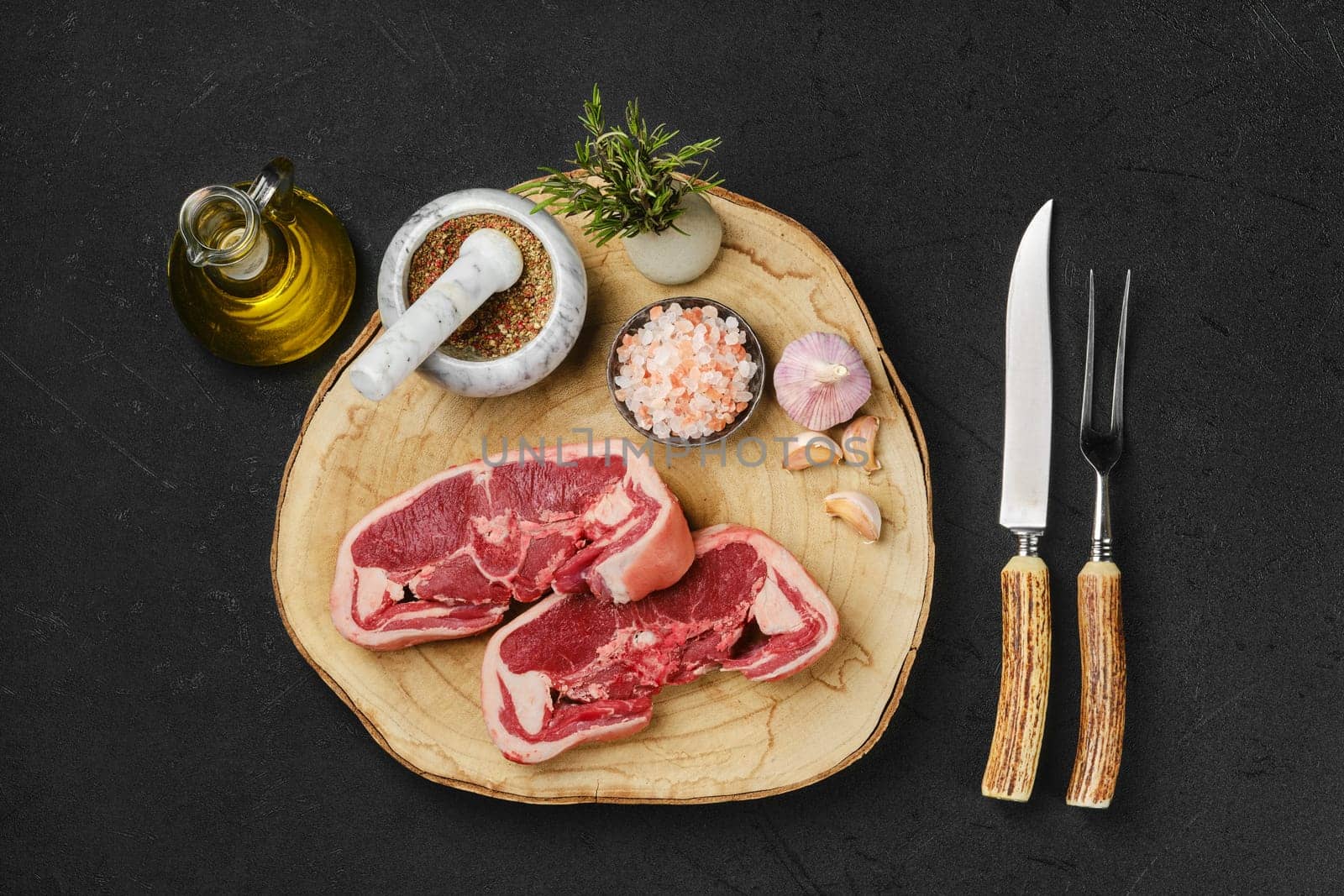 Overhead view of raw fresh lamb double loin chop ready for cooking