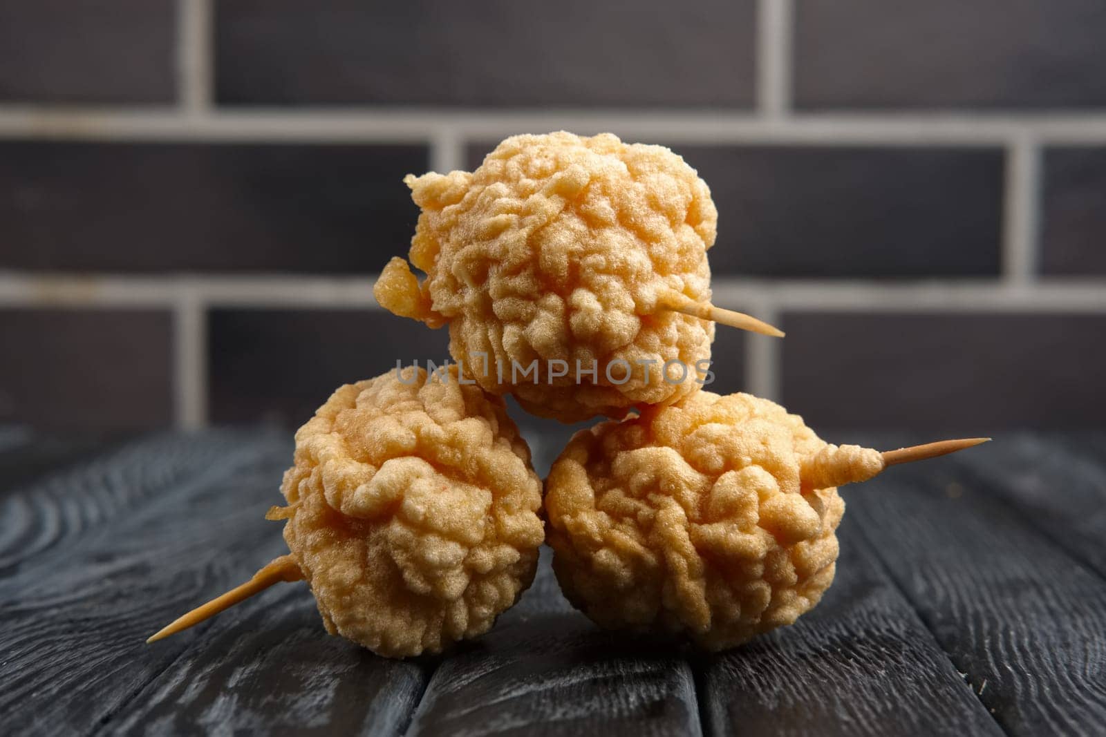Snack for beer - deep fried cheese balls with sauce