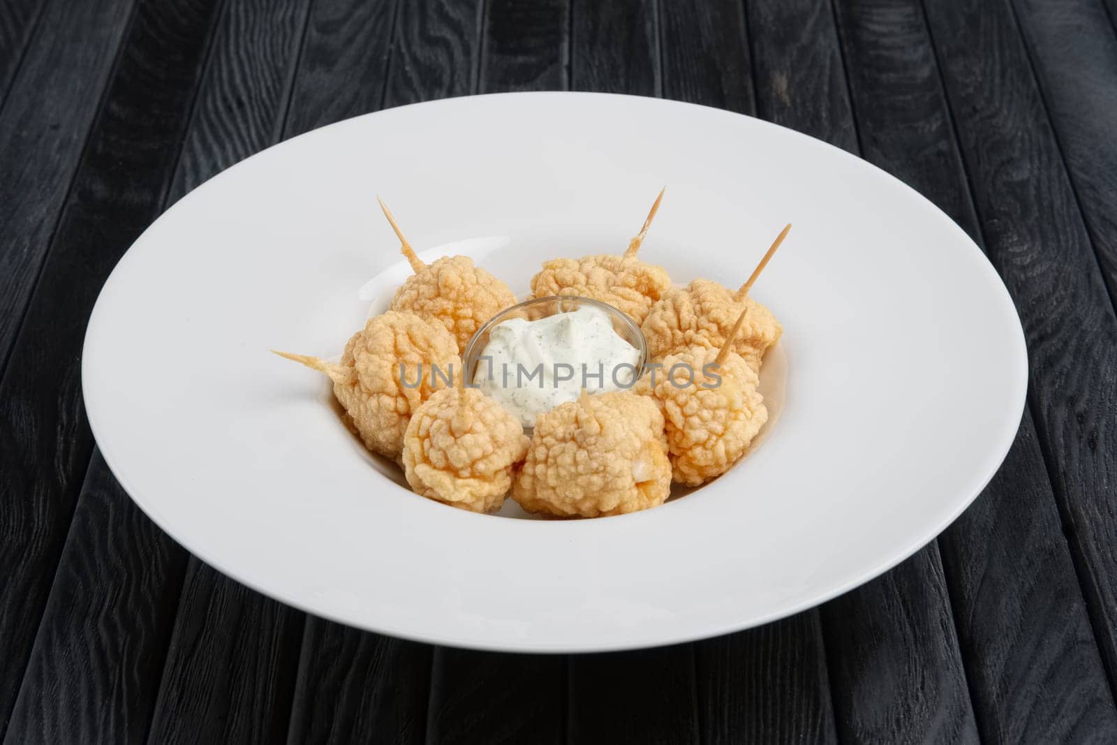 Snack for beer - deep fried cheese balls with sauce