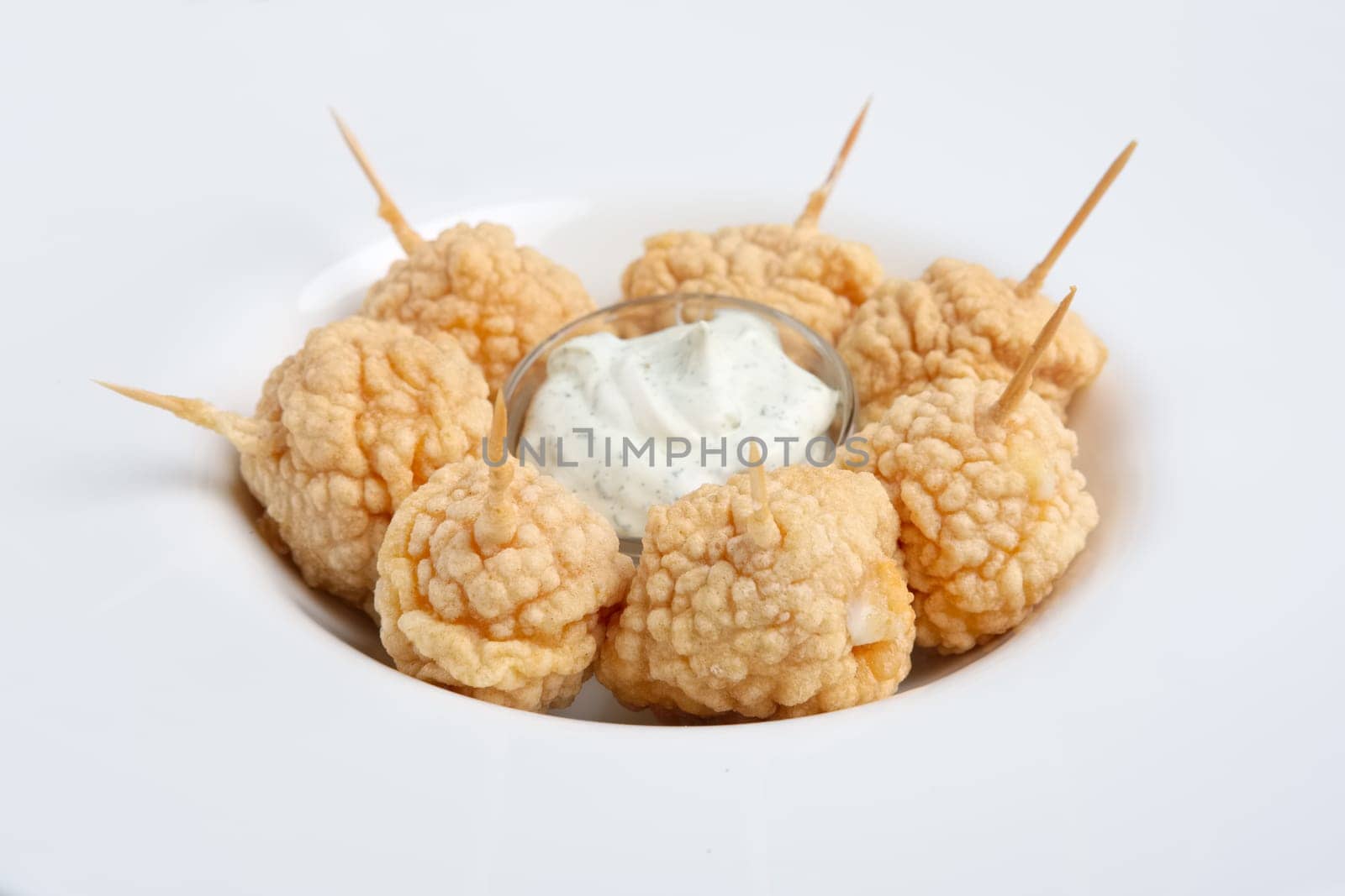 Snack for beer - deep fried cheese balls with sauce