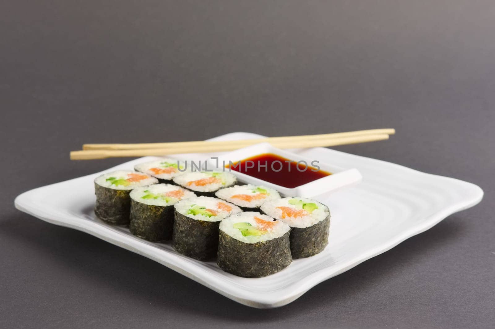 Set of rolls with salmon on plate
