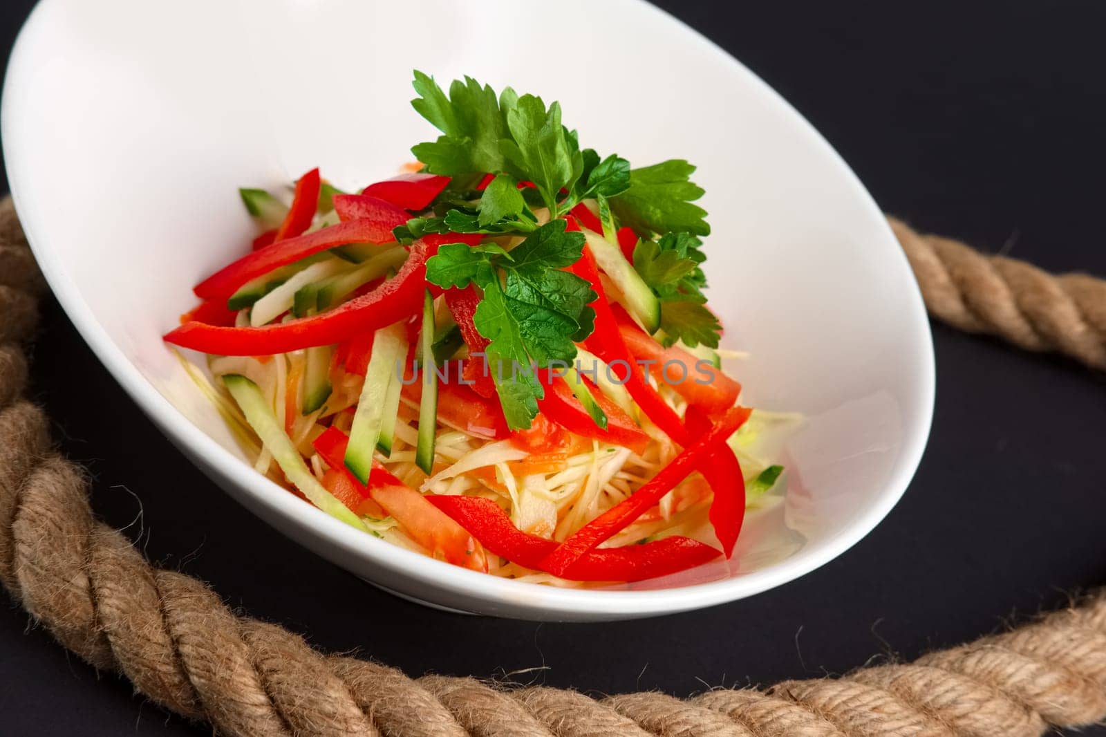 Spring salad with paprika, cucumber and cabbage.