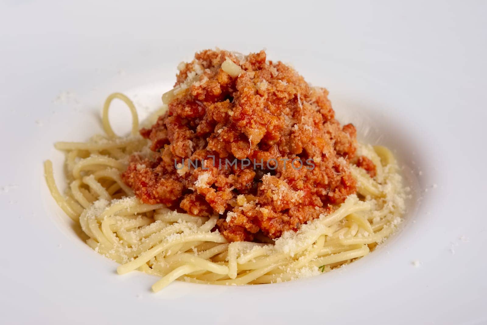 Closeup view of spaghetti with fried ground-meat