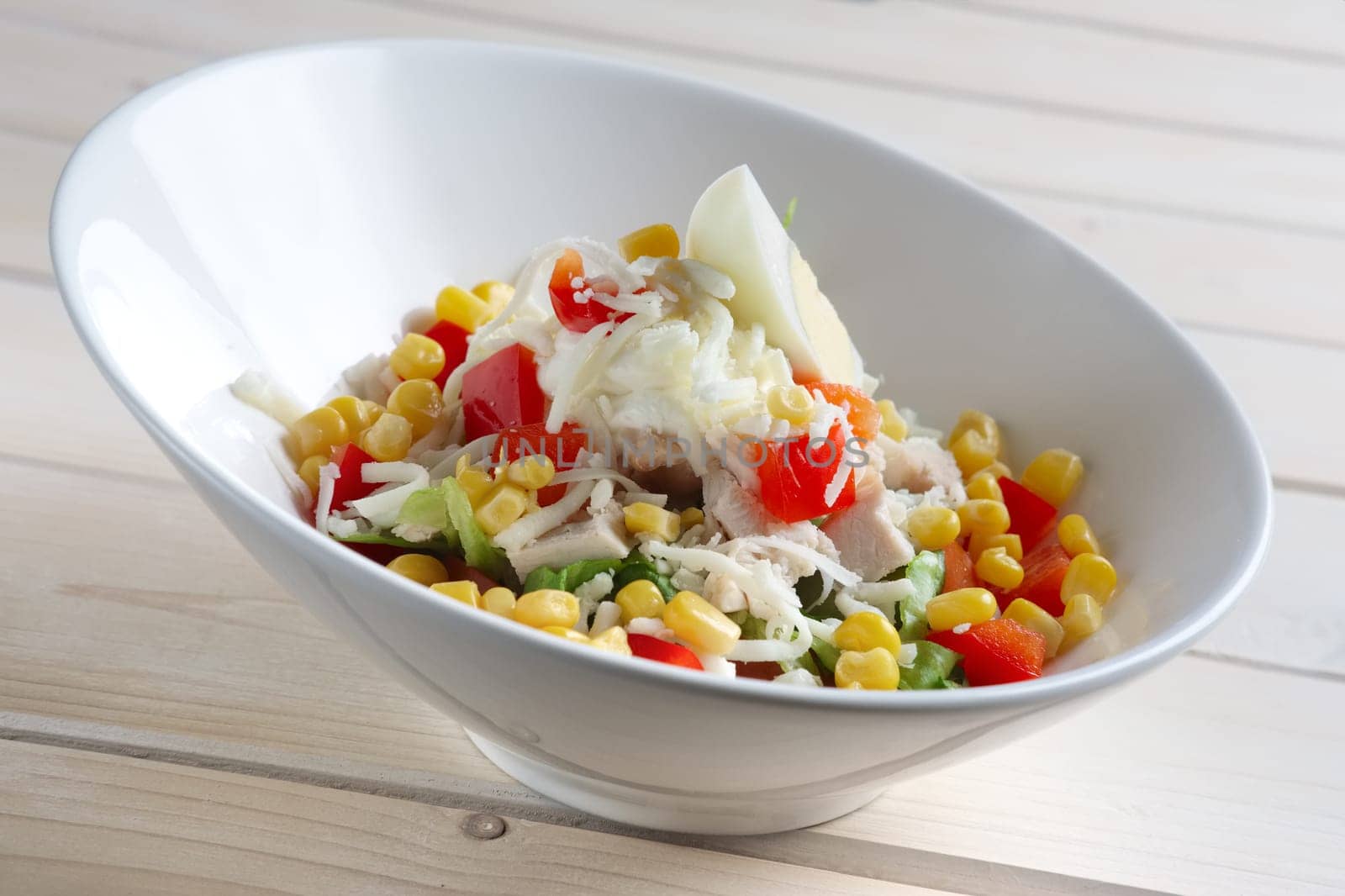 Salad with corn, egg, pepper, cheese