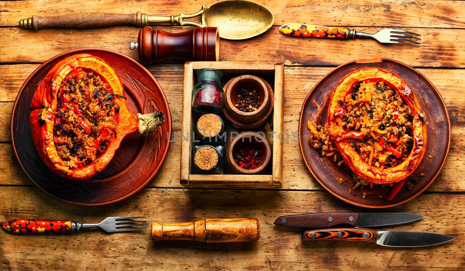 Pumpkin halves with minced meat,vegetables and quinoa.Seasonal pumpkin hokkaido