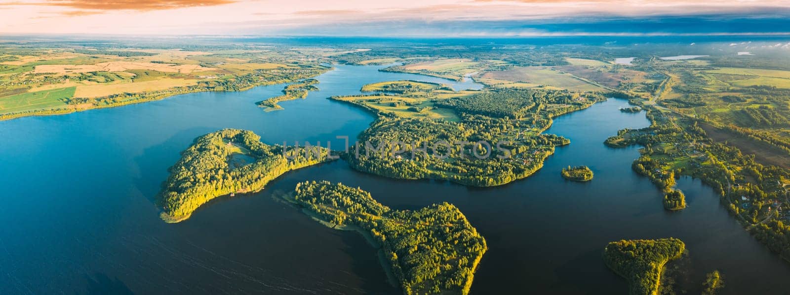 Lyepyel, Lepel Lake, Beloozerny District, Vitebsk Region. Aerial View Of Lyepyel Cityscape Skyline In Autumn Morning. Morning Fog Above Lepel Lake. Top View Of European Nature From High Attitude In Autumn. Bird's Eye View Of Island Pension Lode. Panormic View.