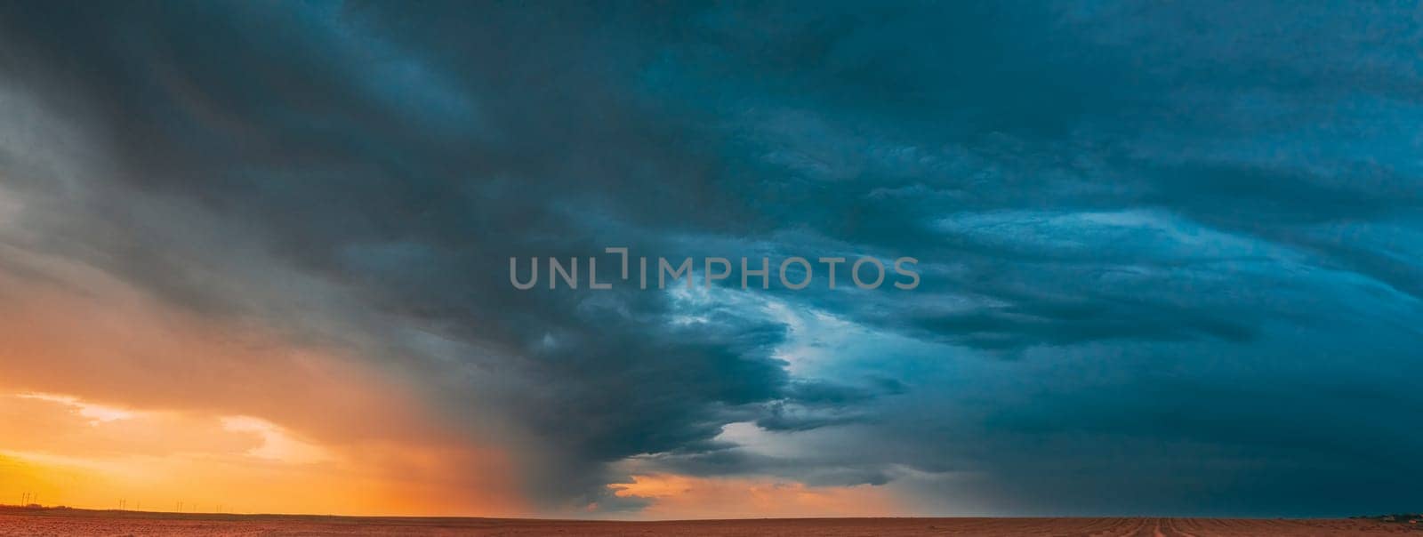 Aerial View Of Sunset Sunrise Bright Sky Above Summer Hay Field Landscape In Evening.