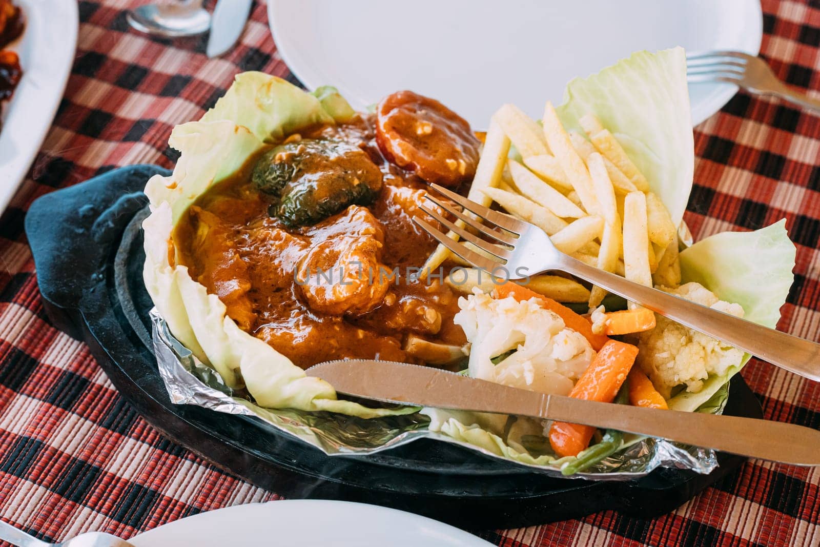 Goa, India. Dish Of Indian National Cuisine Is Sizzler, Which Consist Of French Fries, Fried Shrimp In Sauce, Fried Vegetables. Traditional Dish Of Goa.