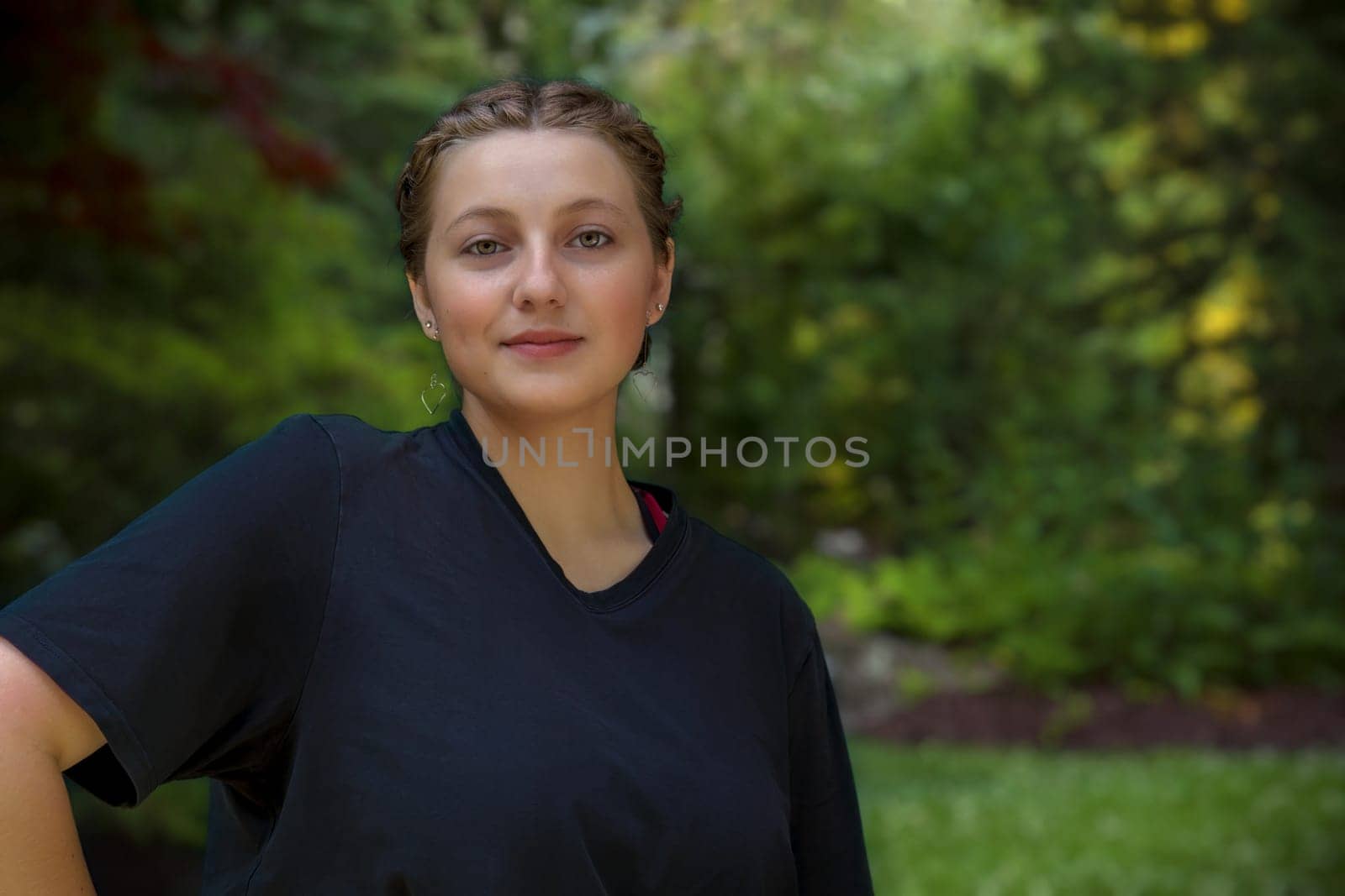 teen woman in a park brunette woman portrait beautiful girl wearing black in nature adult student outside