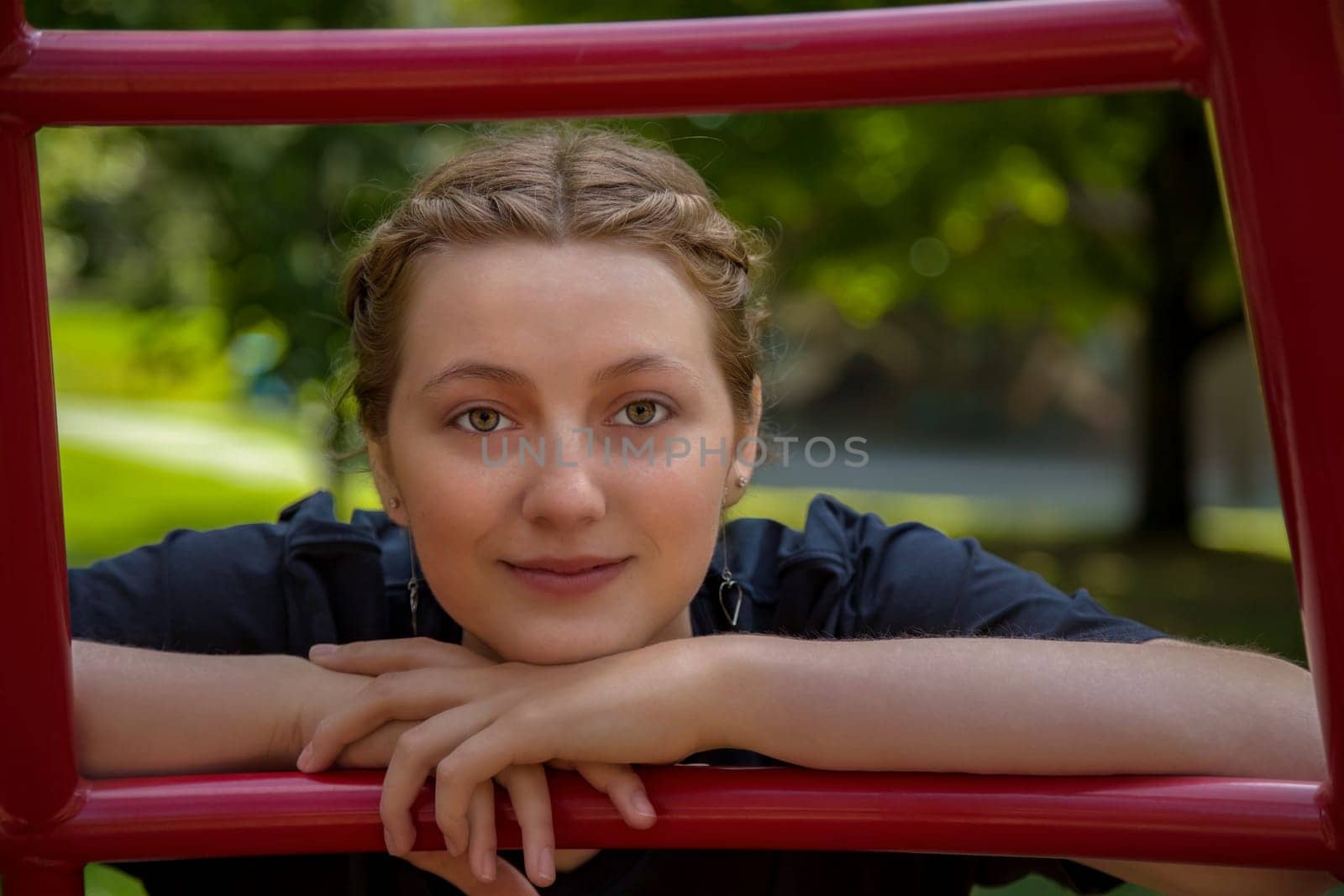 blonde woman at the park posing in red ladder amusement playground youth girl lifestyle enjoyment