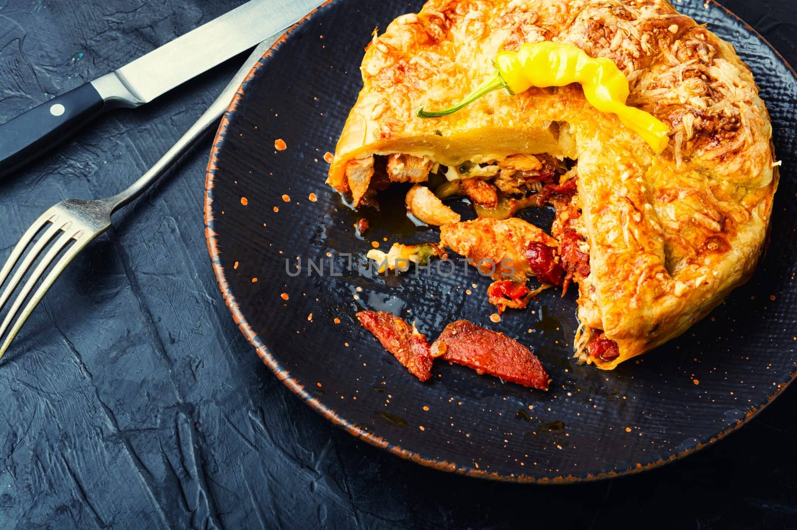 Mexican pie with smoked sausage and chicken. Meat pie.Space for text