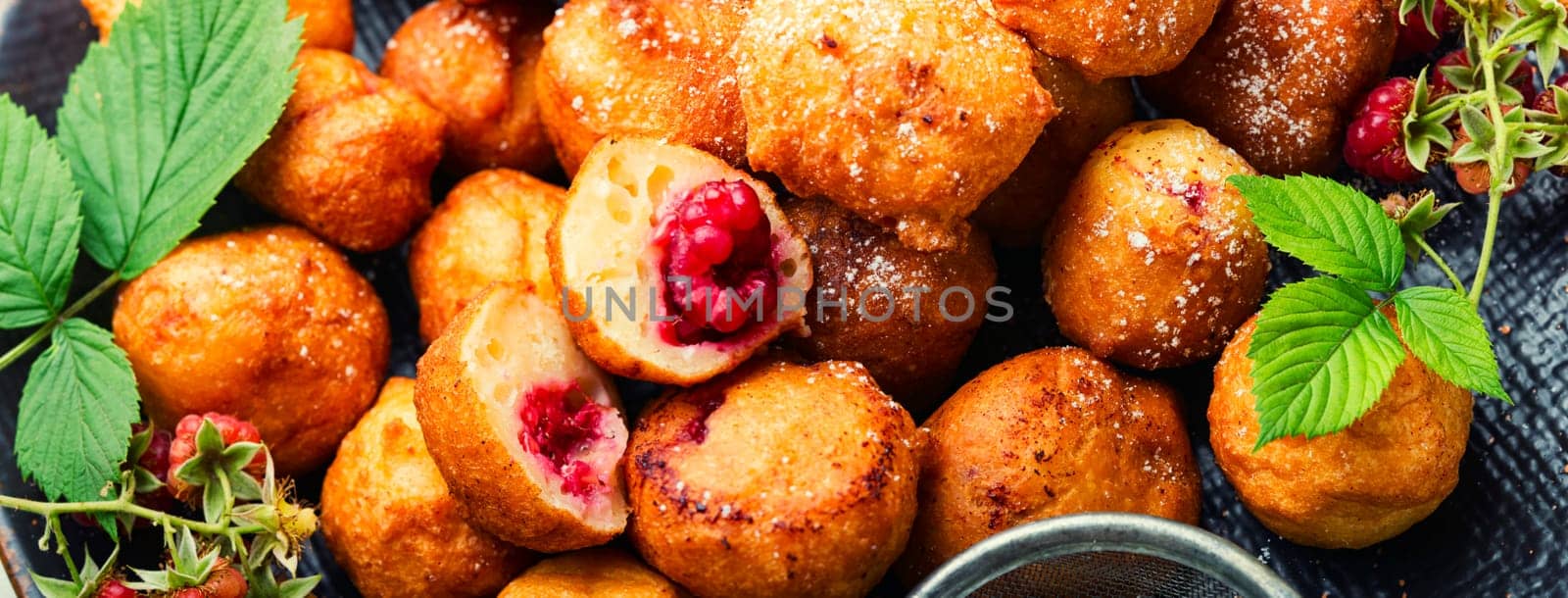 Homemade cottage cheese donuts with berries for tea.Donuts on a plate