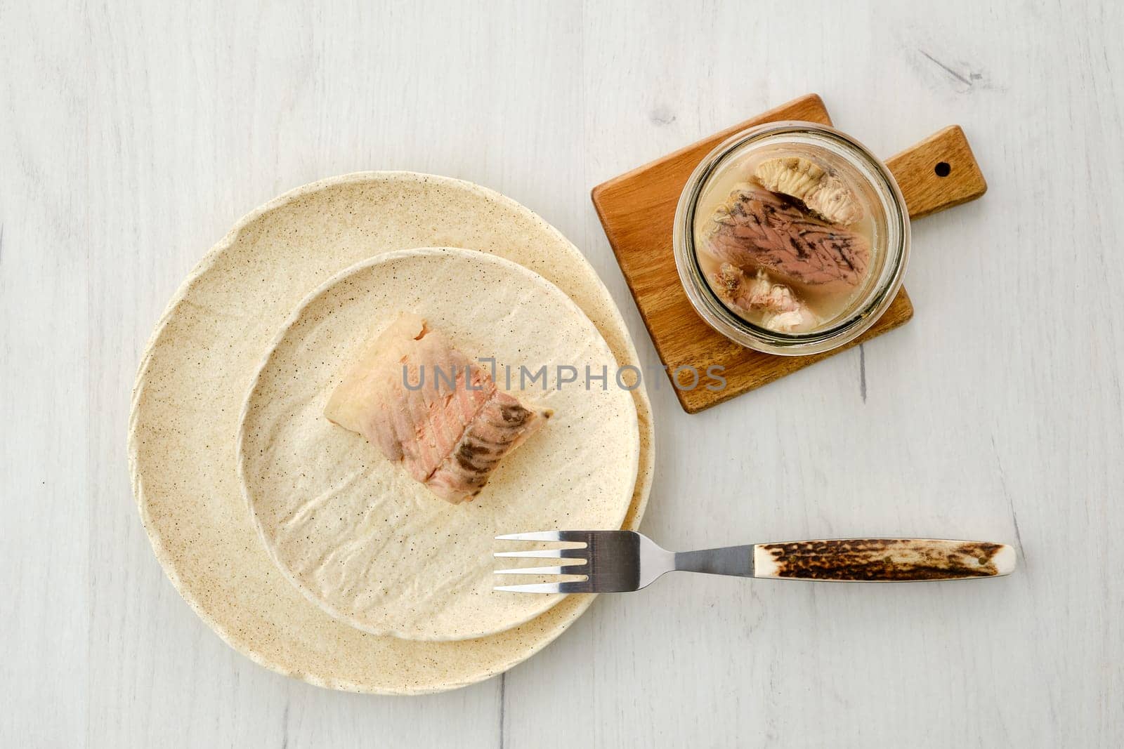 Top view of canned sturgeon on a plate