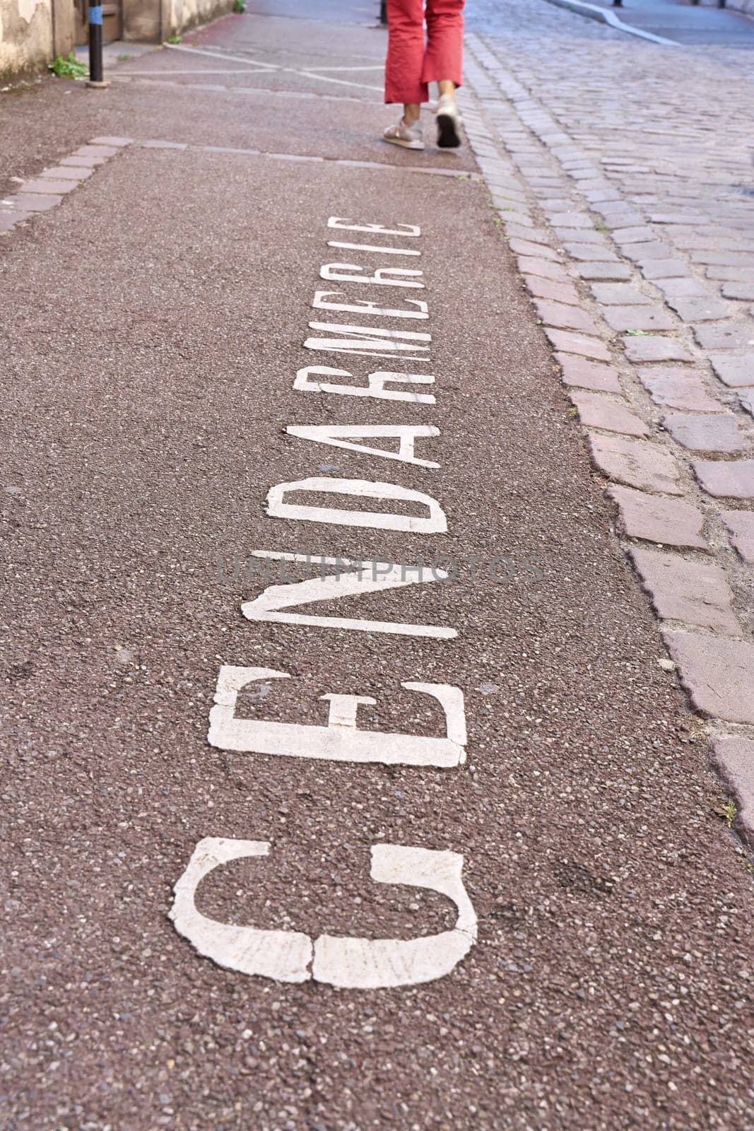 Writing Gendarmerie on a parking lot in front of a police station in Colmar in France