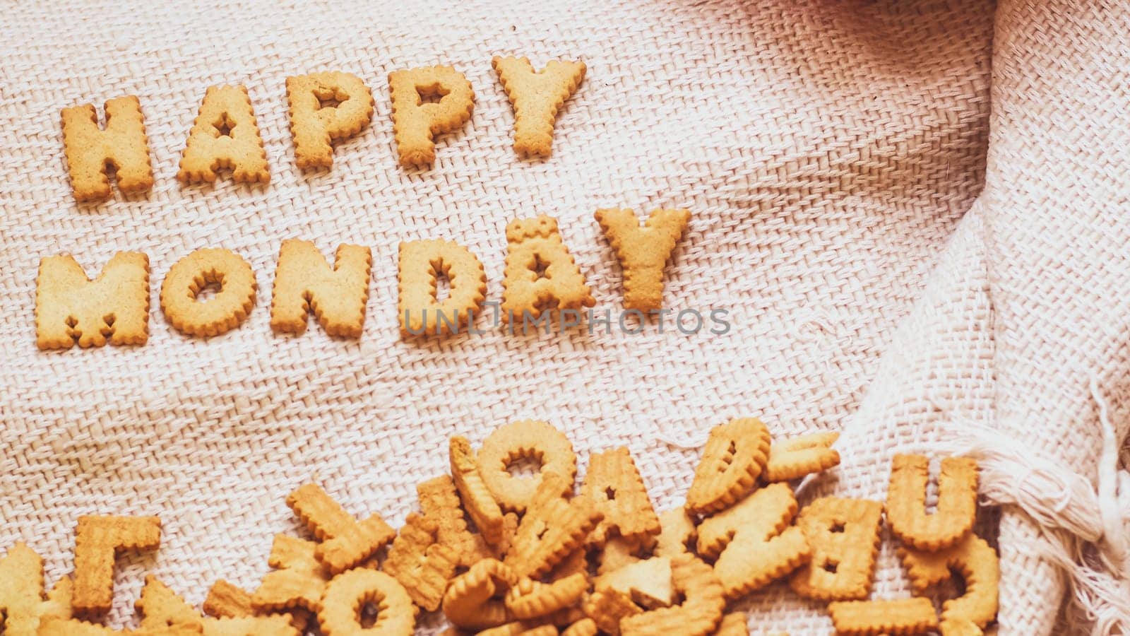 Cookies in the form of the alphabet prospect .Happy from homemade cookies on dark white background. Happy cookies concept.