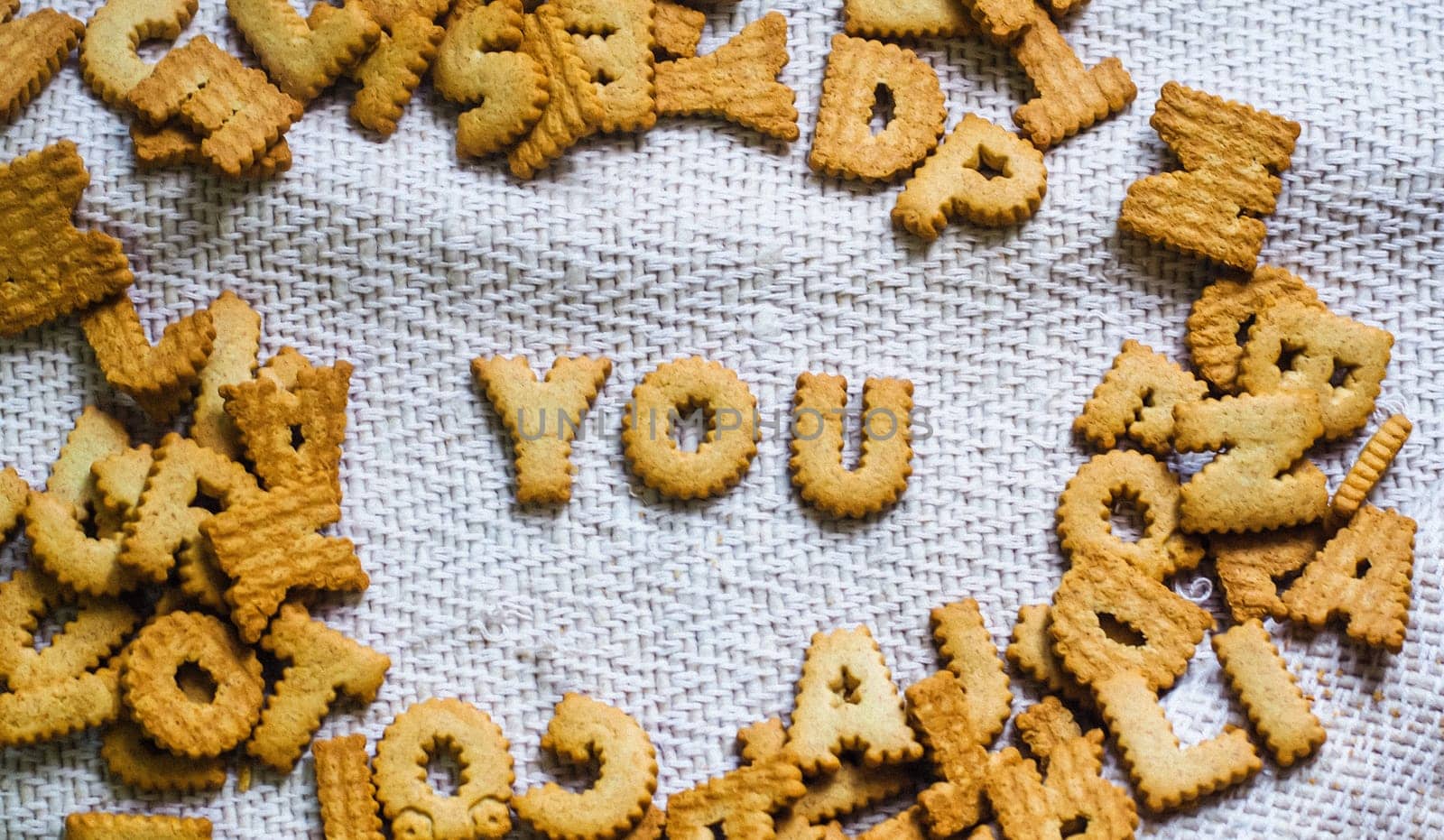 find you Cookies in the form of the alphabet prospe words from homemade cookies on dark white background. woCookies in the form of the alphabet prospect .Happy from homemade cookies on dark white background. Happy cookies concept. rds cookies concept.
